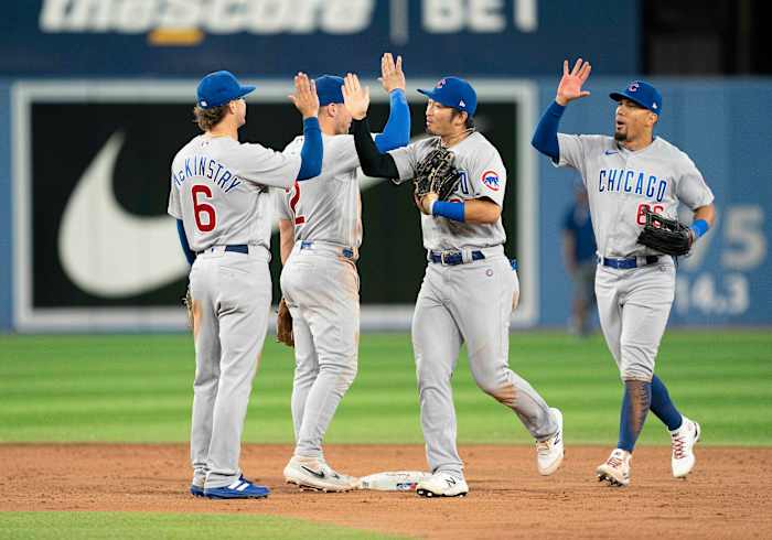 The Chicago Cubs celebrate their Wednesday night win against the Toronto Blue Jays.
